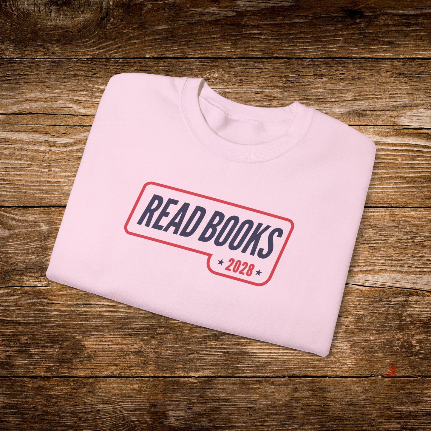 13. Light Pink Folded
Folded light pink Read Books 2028 graphic sweatshirt.