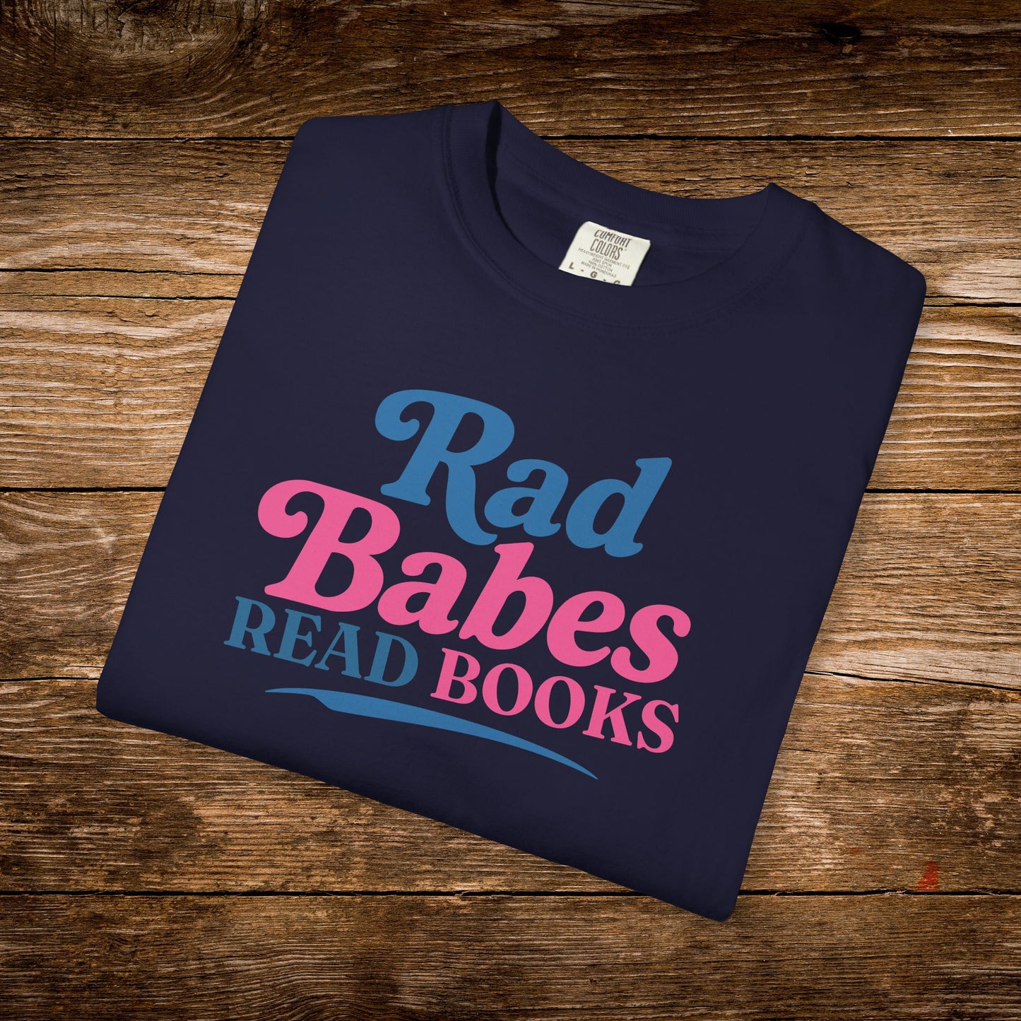 9. Navy Folded
    Folded navy Rad Babes Read Books graphic t-shirt.