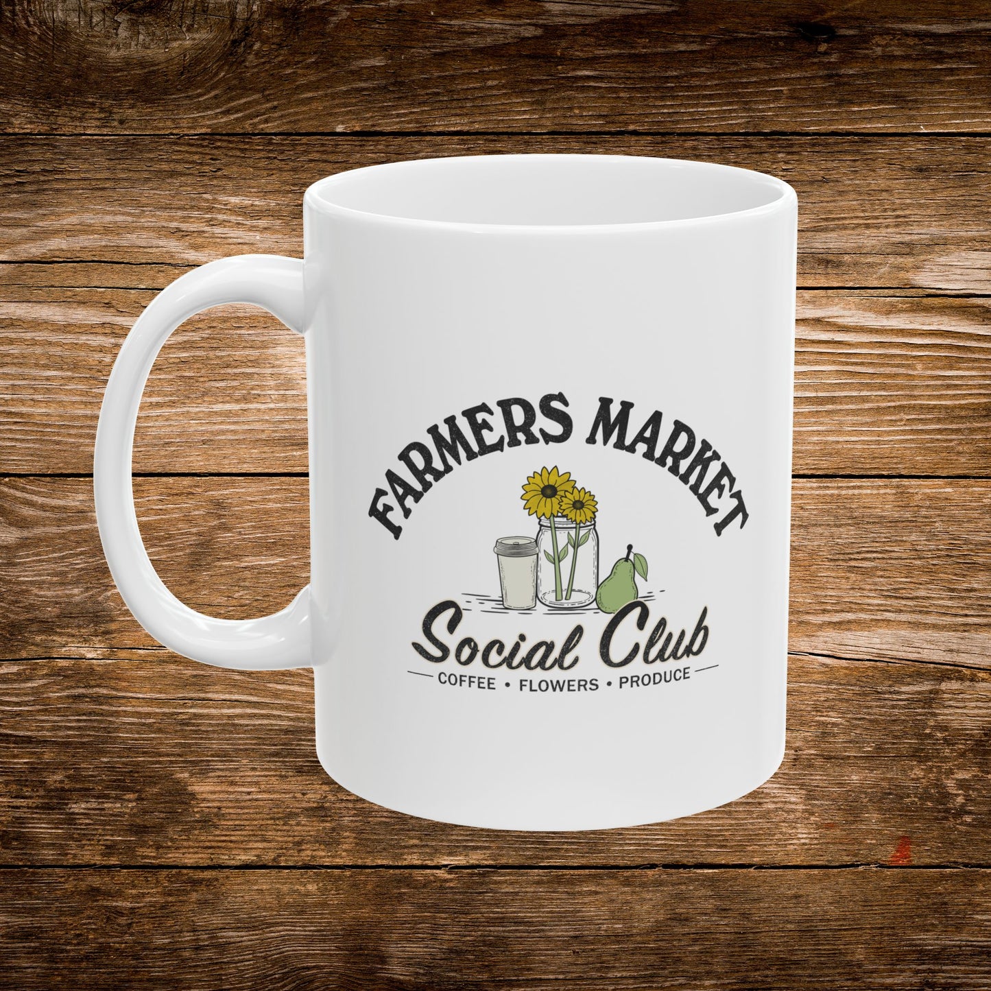 A white ceramic coffee mug with a 'Farmers Market Social Club' graphic, displayed on a rustic dark wood background.