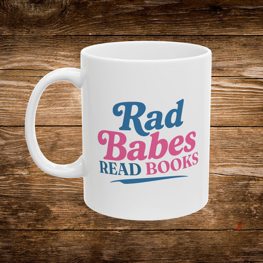 1. Front View
    White ceramic Rad Babes Read Books coffee mug showing the front design.