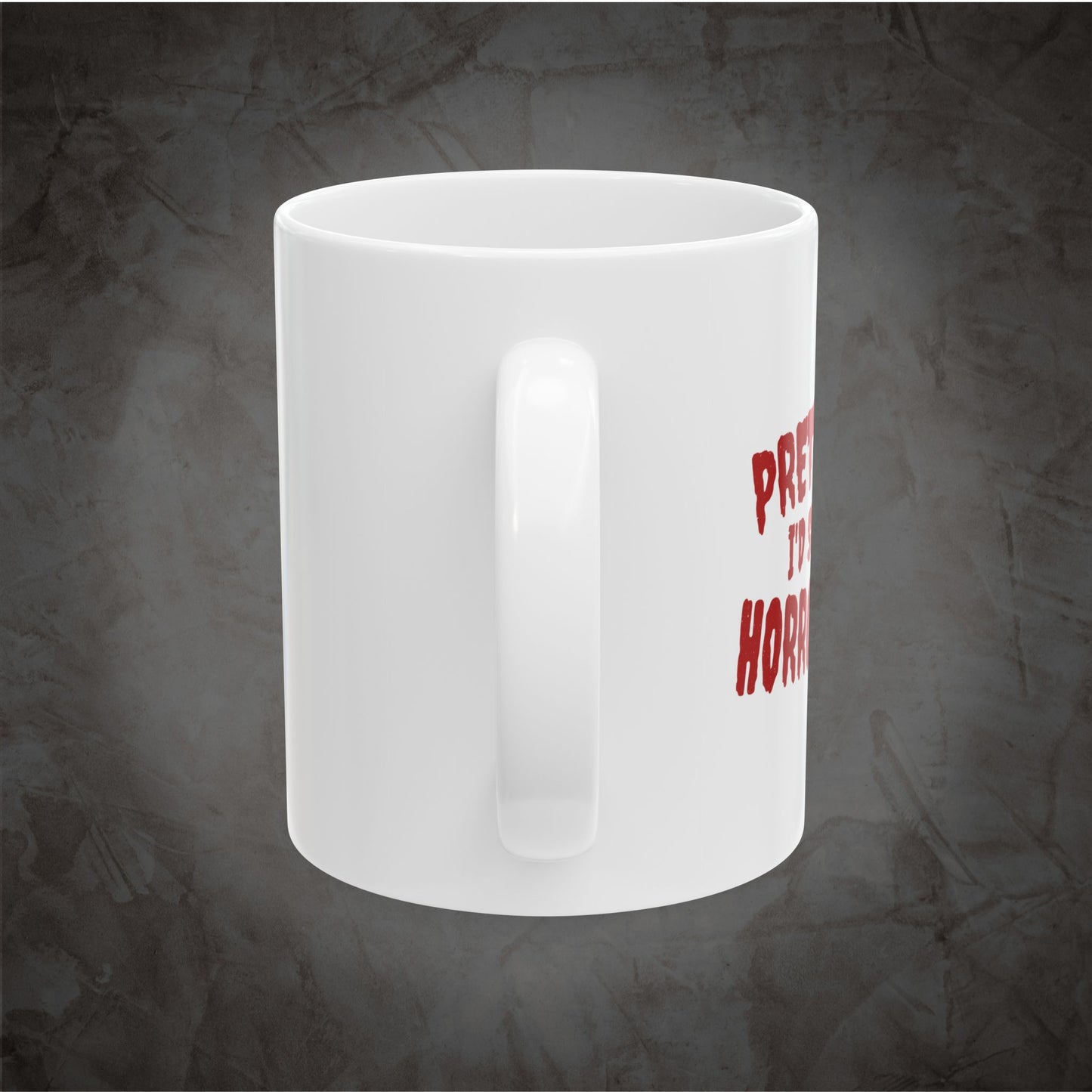 White ceramic Pretty Sure I'd Survive a Horror Movie mug showing the right side of the wraparound red design against a dark textured gray background.
