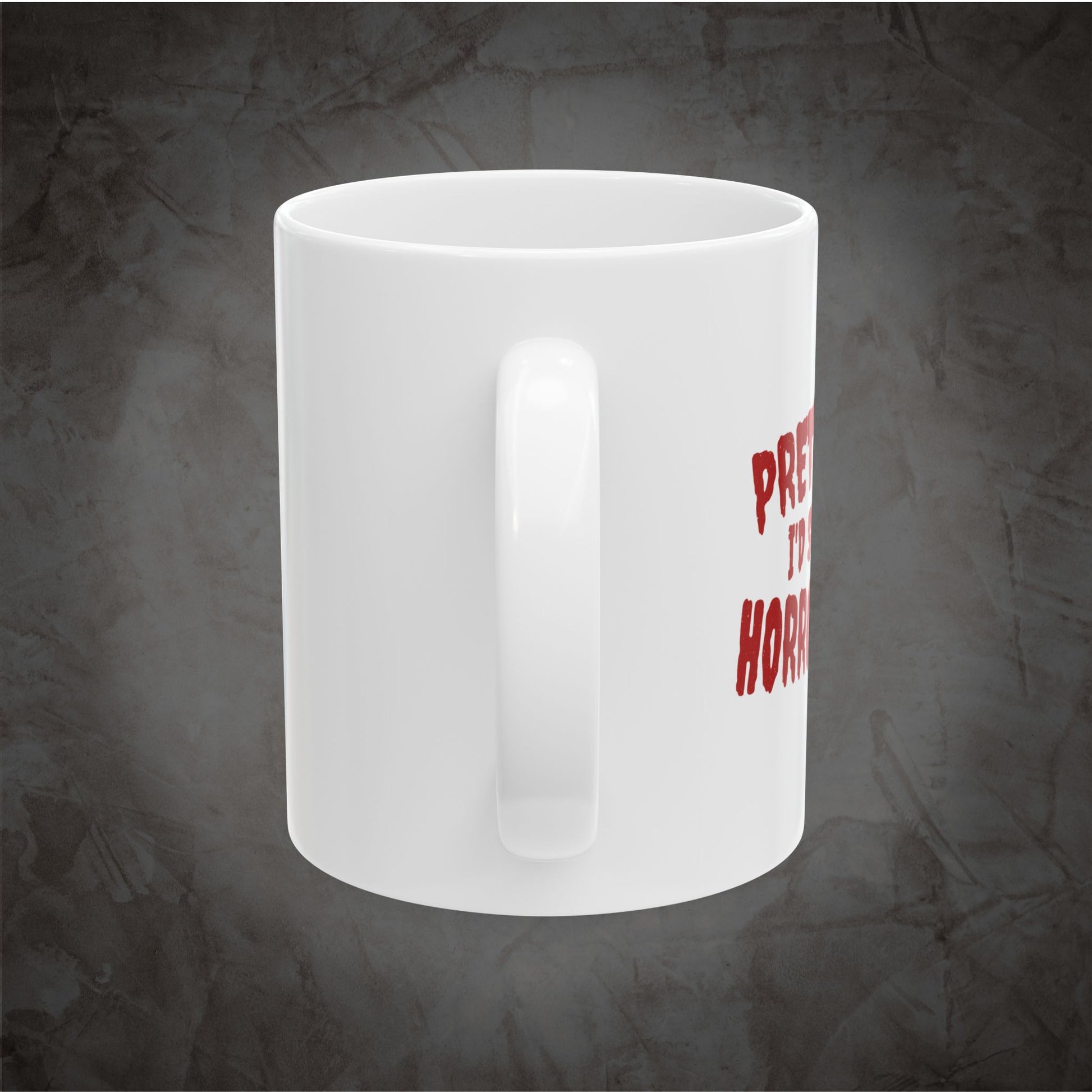 White ceramic Pretty Sure I'd Survive a Horror Movie mug showing the right side of the wraparound red design against a dark textured gray background.