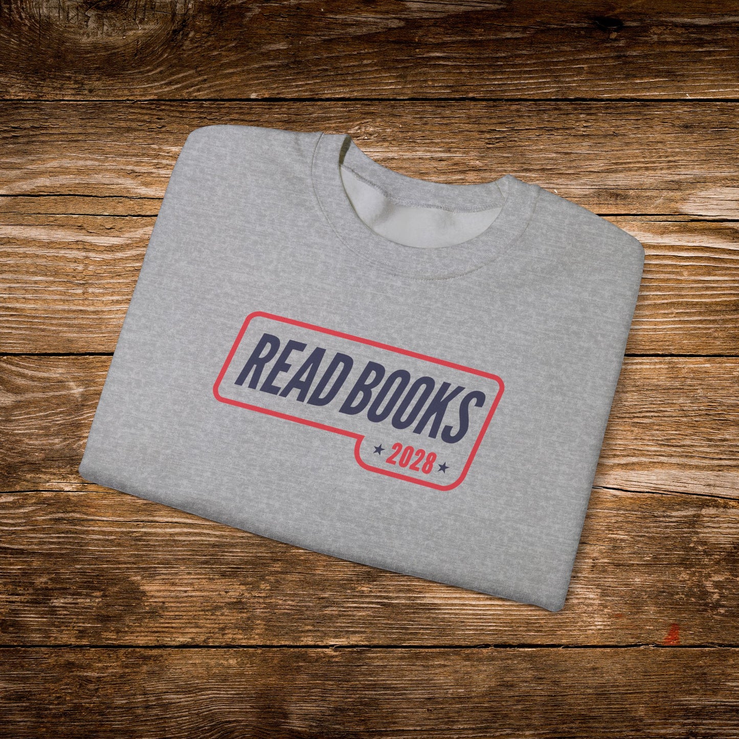 9. Sport Grey Folded
    Folded sport grey Read Books 2028 graphic sweatshirt.