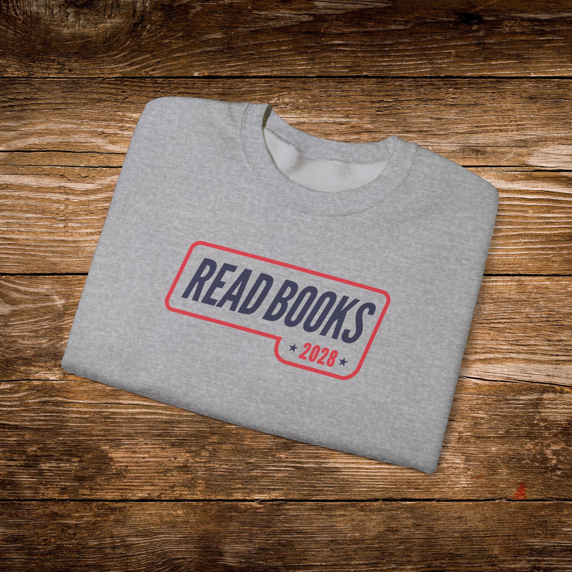 9. Sport Grey Folded
    Folded sport grey Read Books 2028 graphic sweatshirt.