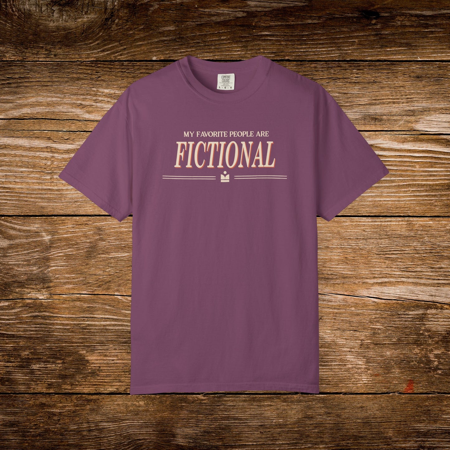 Purple t-shirt with text on a wooden background