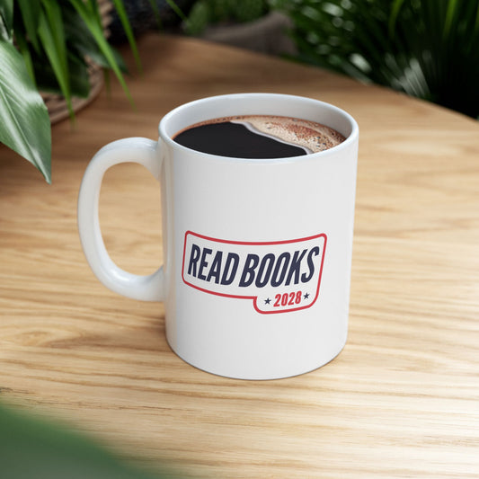 1. Lifestyle Mockup
    Read Books 2028 ceramic mug filled with coffee on a wooden table.