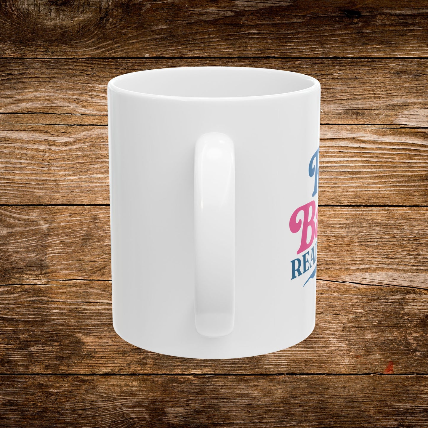 4. Back View
    White ceramic Rad Babes Read Books mug showing the back and handle.