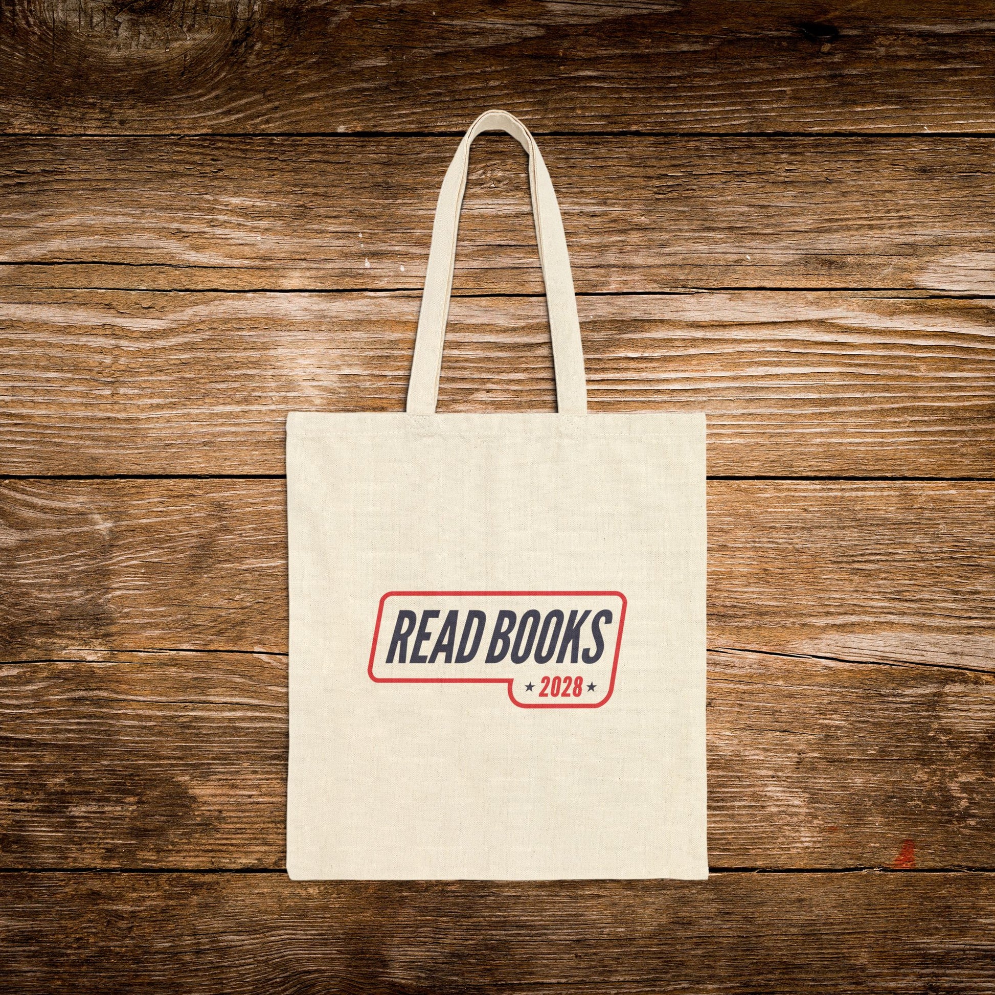 2. Front View
    Natural cotton Read Books 2028 canvas tote bag with vintage campaign-inspired design.