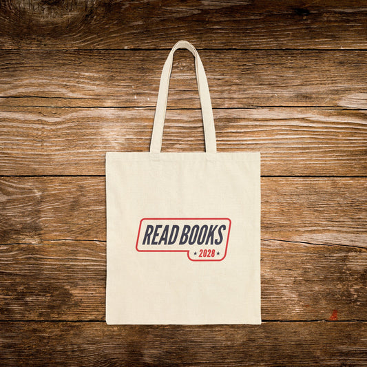 2. Front View
    Natural cotton Read Books 2028 canvas tote bag with vintage campaign-inspired design.