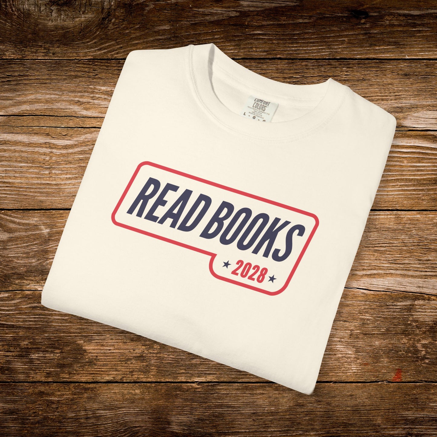 6. Folded Flat Lay
    Folded ivory Read Books 2028 graphic t-shirt.