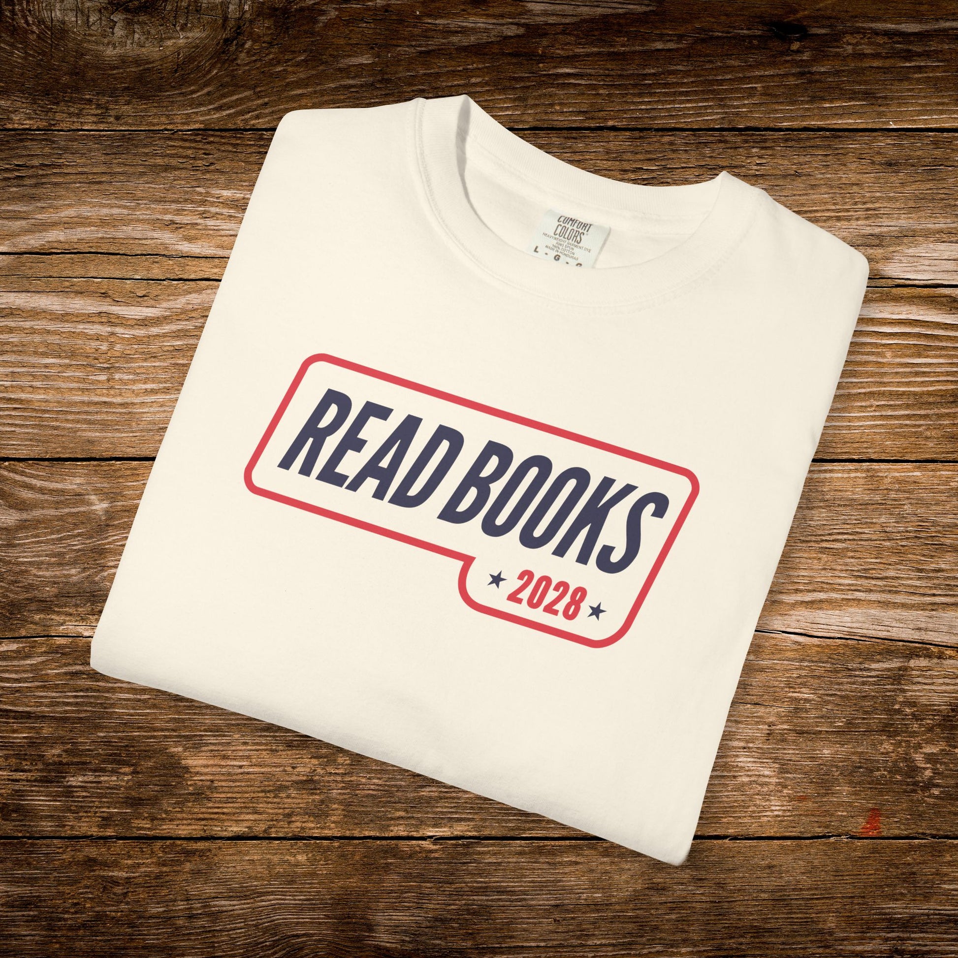 6. Folded Flat Lay
    Folded ivory Read Books 2028 graphic t-shirt.
