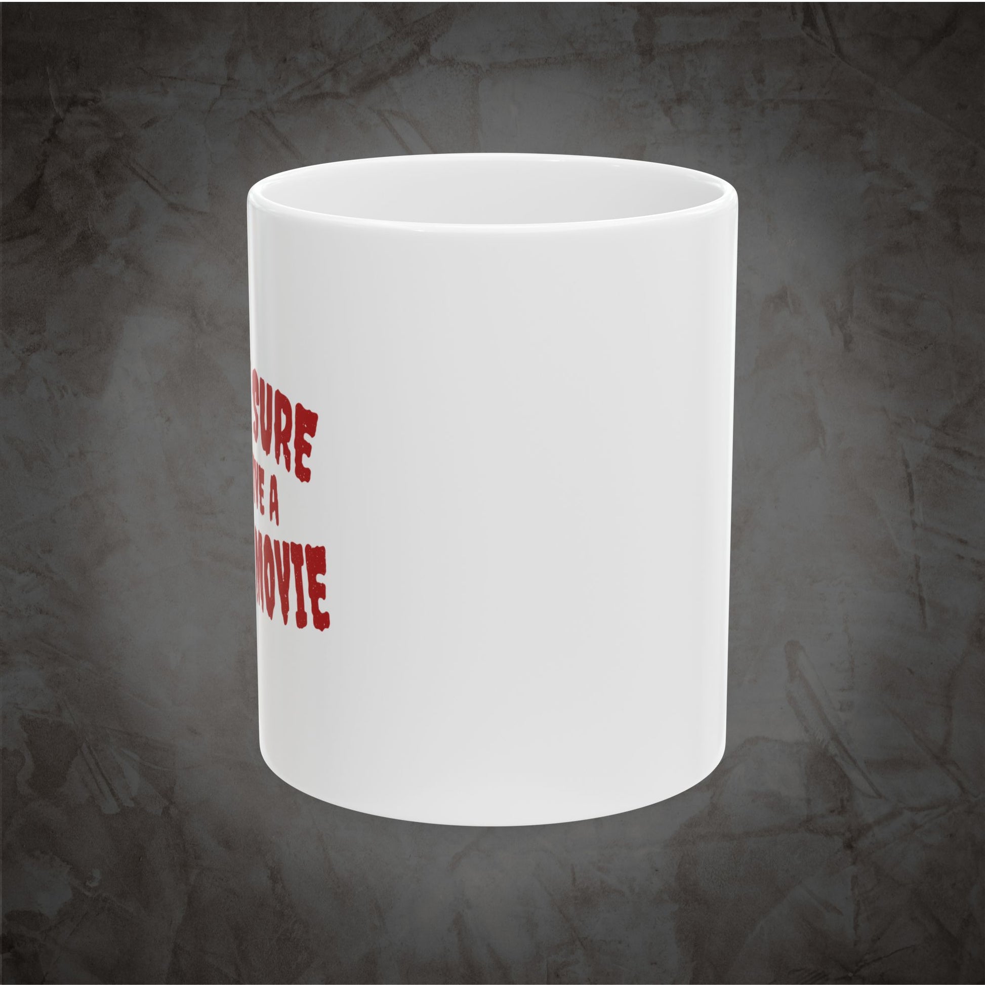 White ceramic Pretty Sure I'd Survive a Horror Movie mug showing the left side of the wraparound red design against a dark textured gray background.