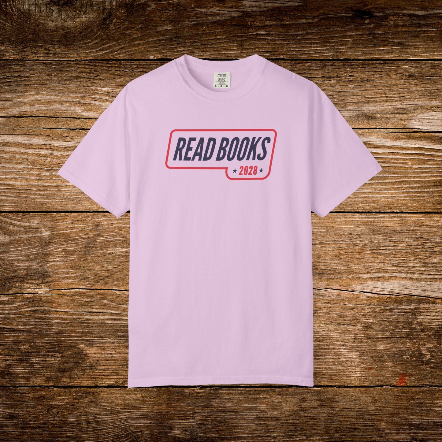 11. Orchid Shirt
    Read Books 2028 graphic t-shirt shown on an orchid Comfort Colors tee.