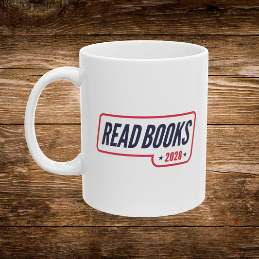 2. Front View
    White ceramic Read Books 2028 coffee mug showing the front design.