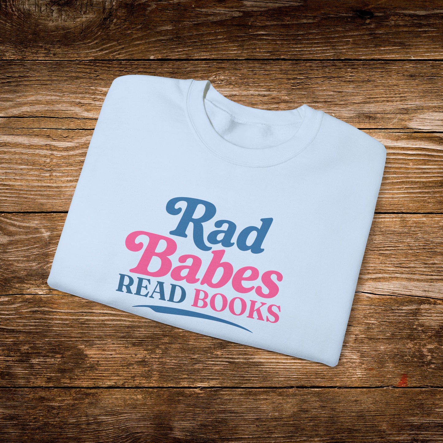 10. Light Blue Folded
    Folded light blue Rad Babes Read Books graphic sweatshirt.