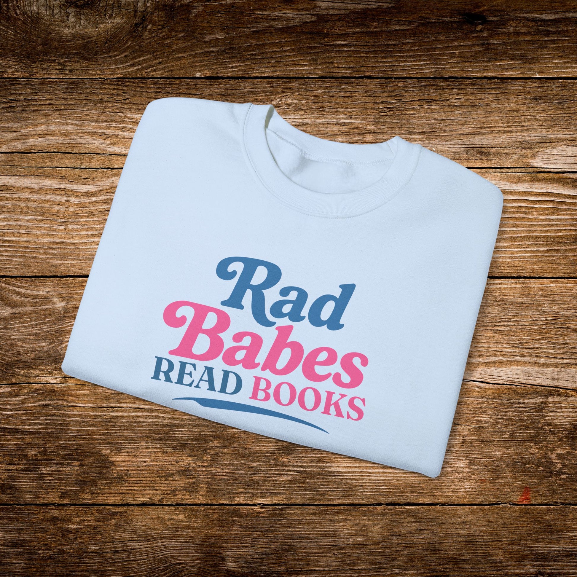 10. Light Blue Folded
    Folded light blue Rad Babes Read Books graphic sweatshirt.