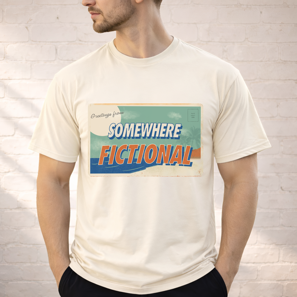 Person wearing an ivory “Greetings from Somewhere Fictional” retro postcard graphic t-shirt.