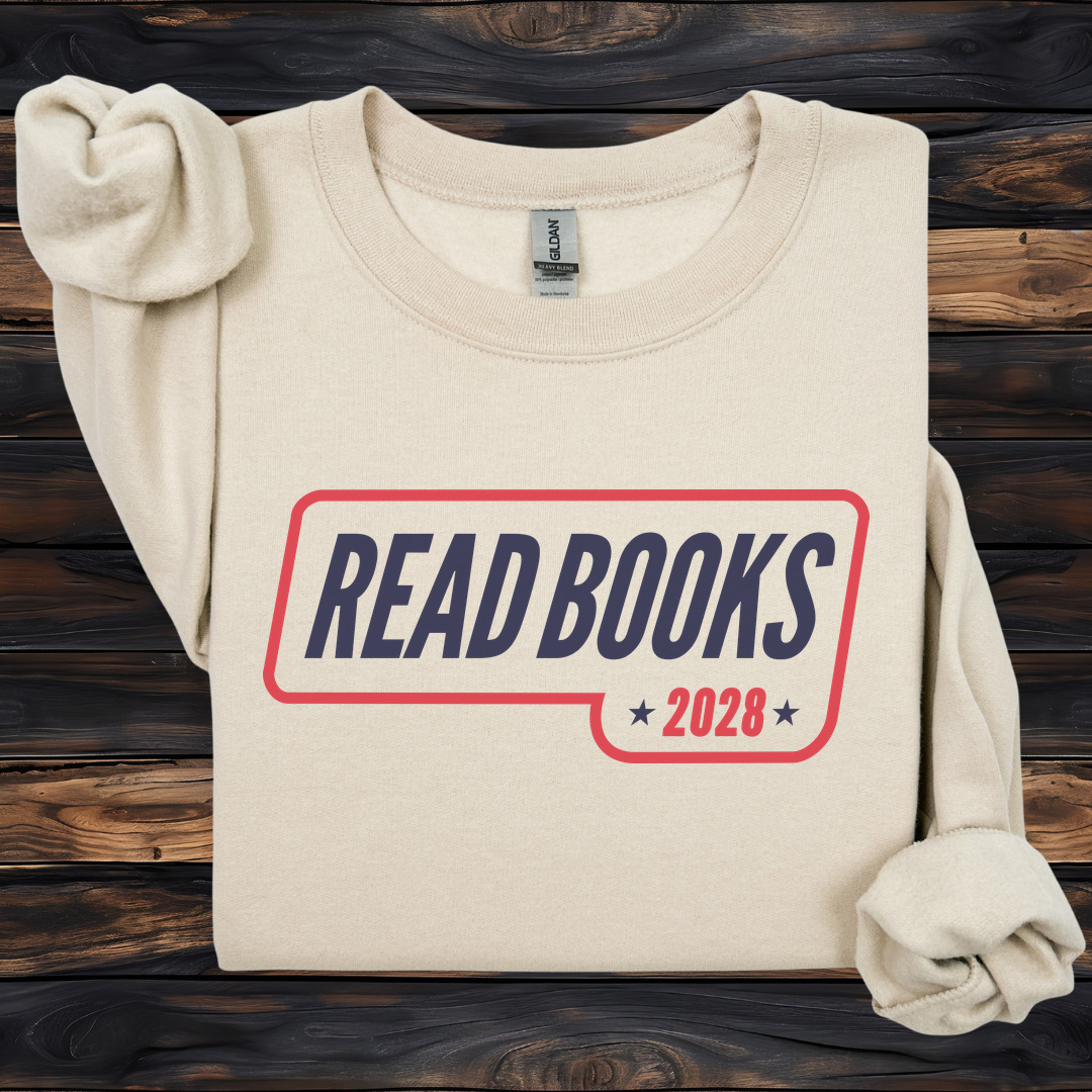 1. Main Image
    Read Books 2028 graphic sweatshirt on a sand Gildan crewneck.