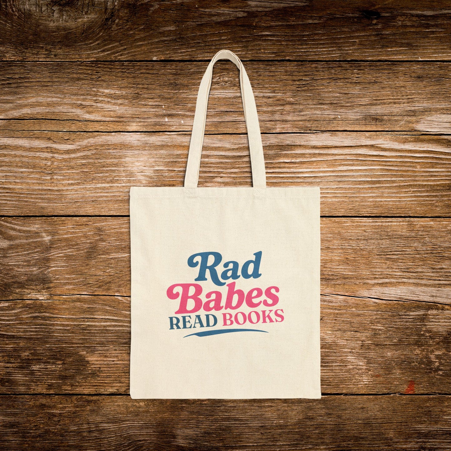 2. Front View
    Natural cotton Rad Babes Read Books  canvas tote bag with vintage reader design.