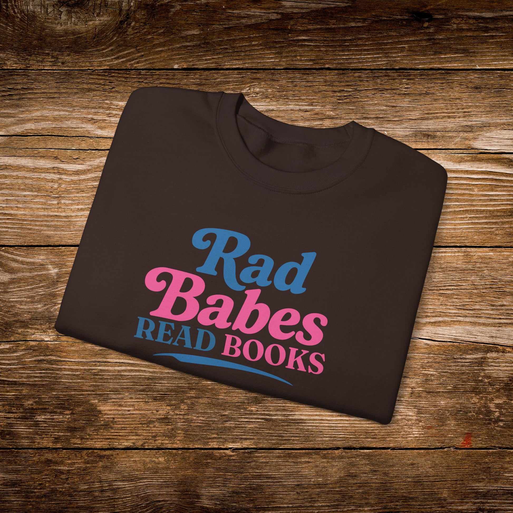 6. Dark Chocolate Folded
    Folded dark chocolate Rad Babes Read Books graphic sweatshirt.