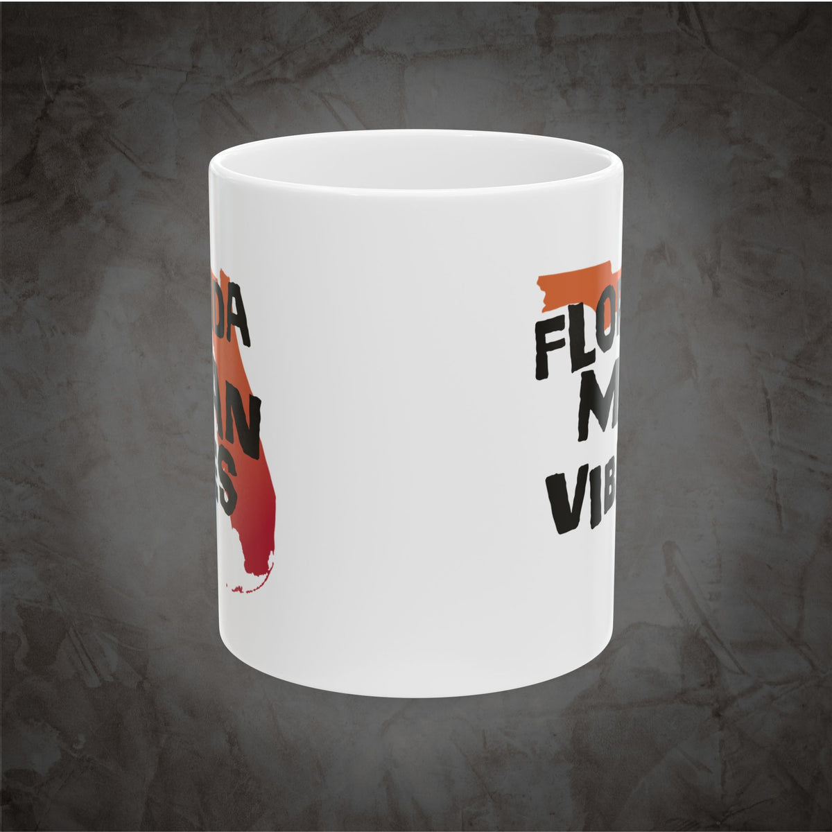 A white ceramic mug featuring a Florida-themed graphic with a red and orange Florida state silhouette and black text reading 'FLO.