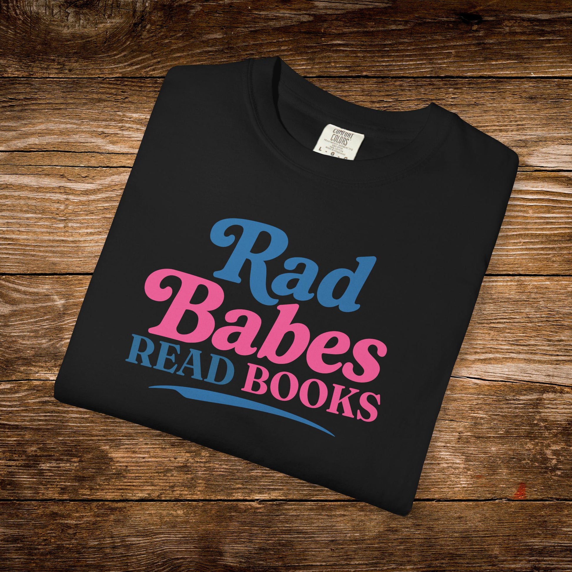 7. Black Folded
    Folded black Rad Babes Read Books graphic t-shirt.