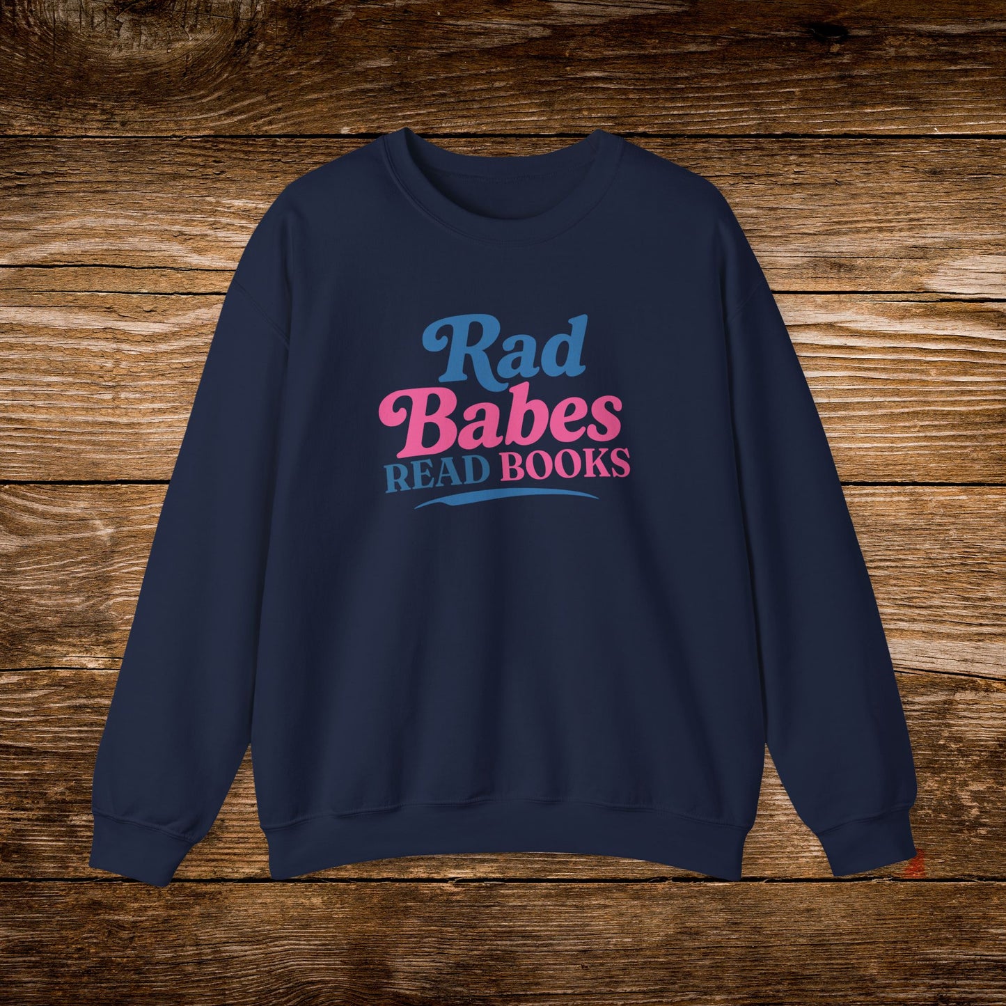 7. Navy Sweatshirt
    Rad Babes Read Books graphic sweatshirt shown on a navy crewneck.