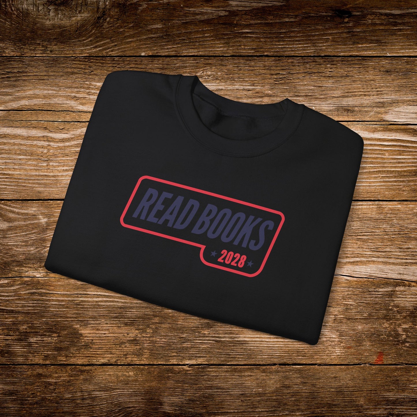 7. Black Folded
    Folded black Read Books 2028 graphic sweatshirt.