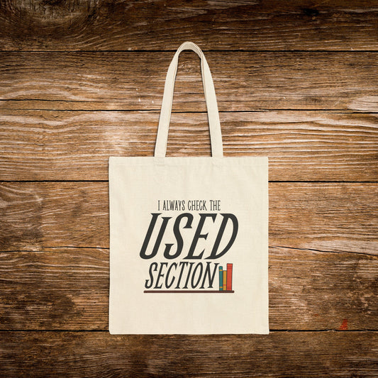 2. Front View
    Natural cotton I Always Check the Used Section canvas tote bag with vintage reader design.