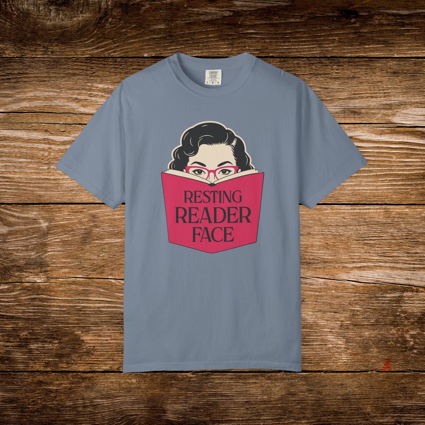 Resting Reader Face graphic t-shirt shown on a blue spruce Comfort Colors tee.