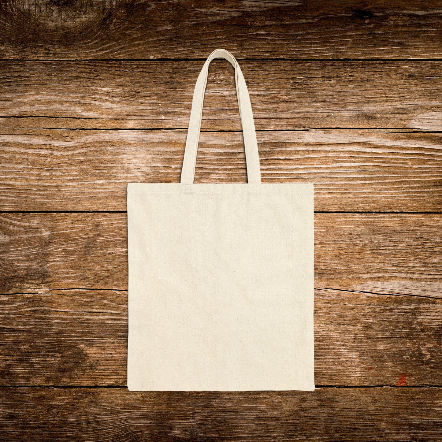 Beige tote bag on a wooden surface