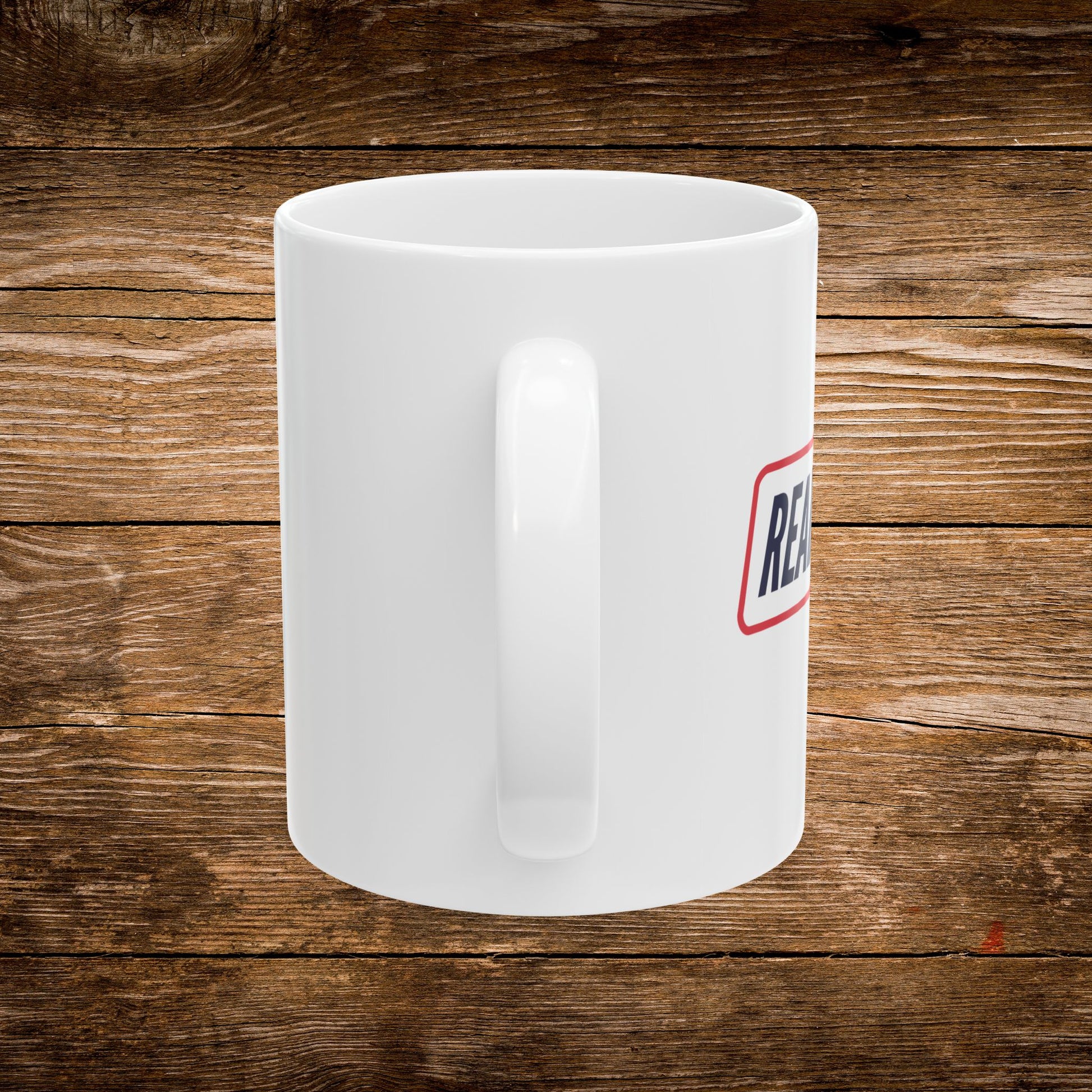 4. Back View
    White ceramic Read Books 2028 mug showing the back and handle.