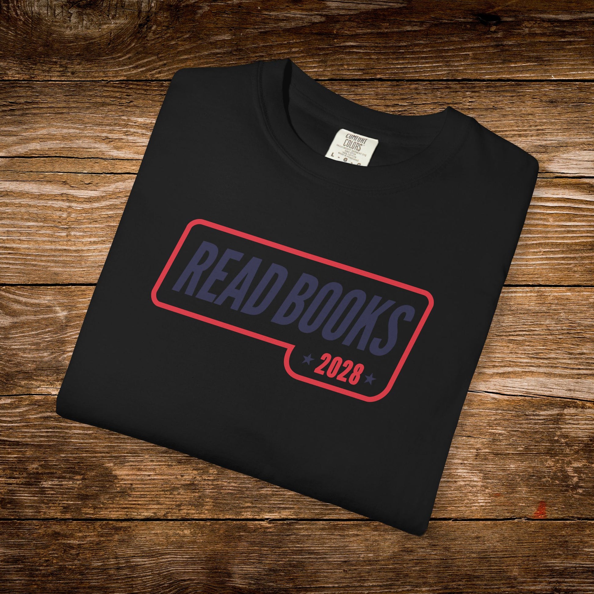 8. Black Folded
    Folded black Read Books 2028 graphic t-shirt.