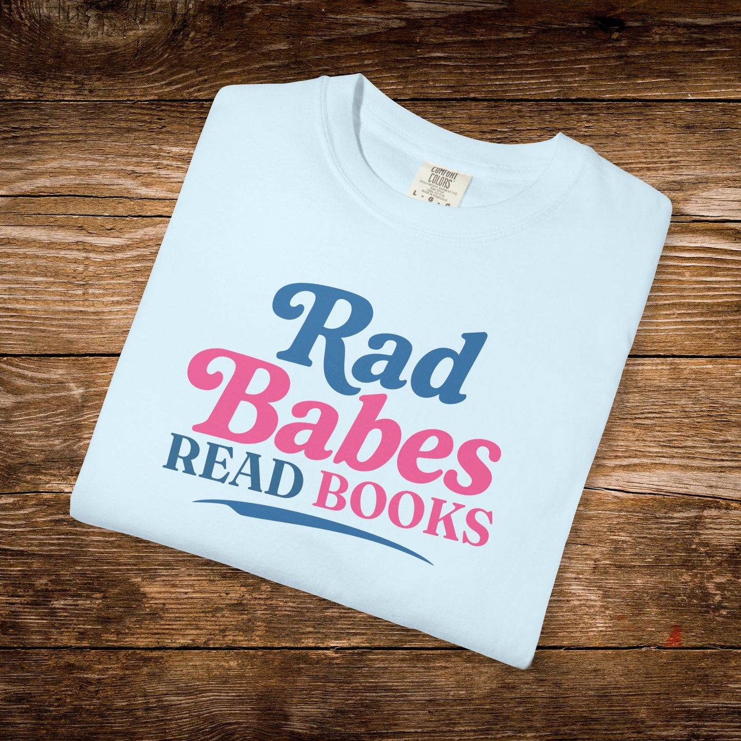 11. Light Blue Folded
    Folded light blue Rad Babes Read Books graphic t-shirt.