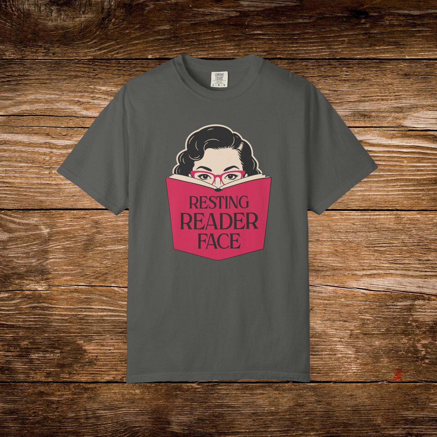 Resting Reader Face graphic t-shirt shown on a pepper Comfort Colors tee.